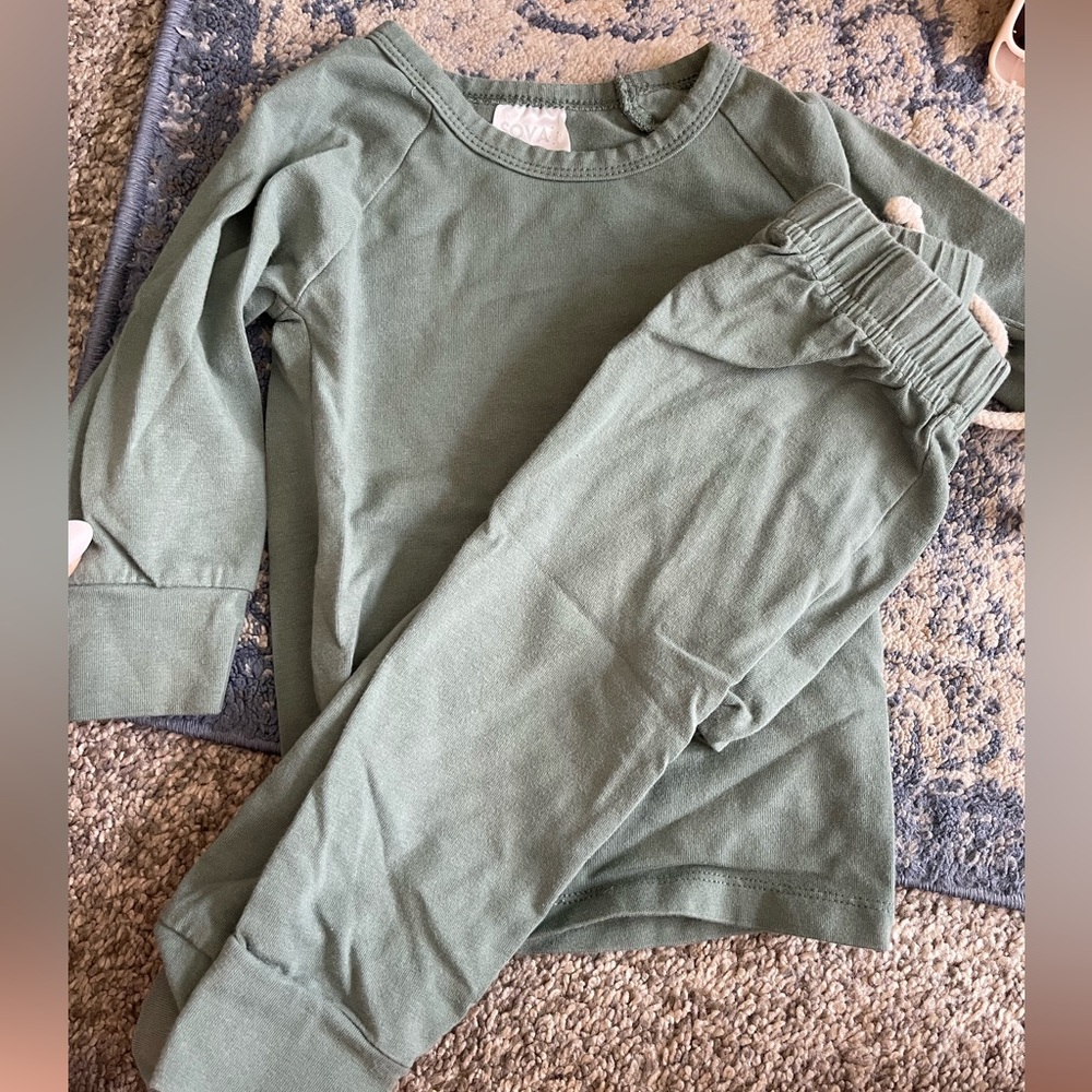 A sage green baby set